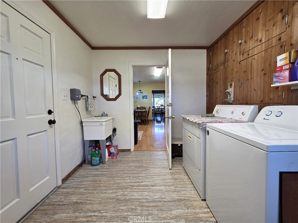 23773 River Road Corning, CA 96021 - Photo 14 of 64 a view of storage and utility room with washer and dryer
