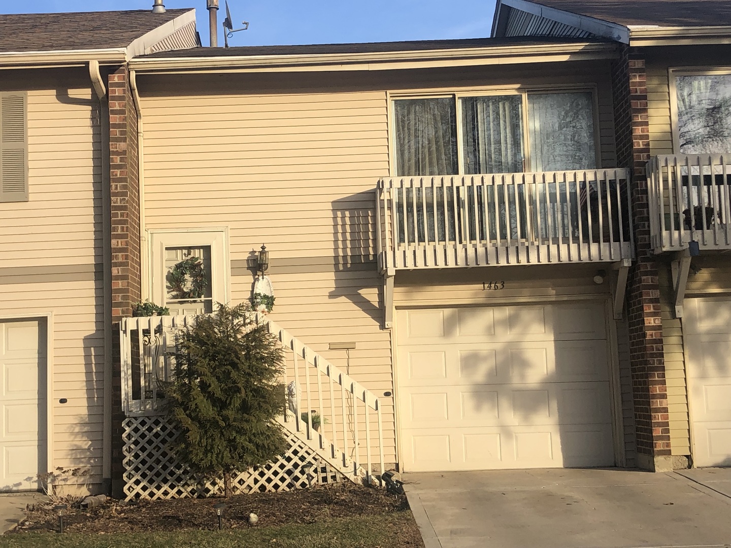 a view of a house with a door and wooden floor