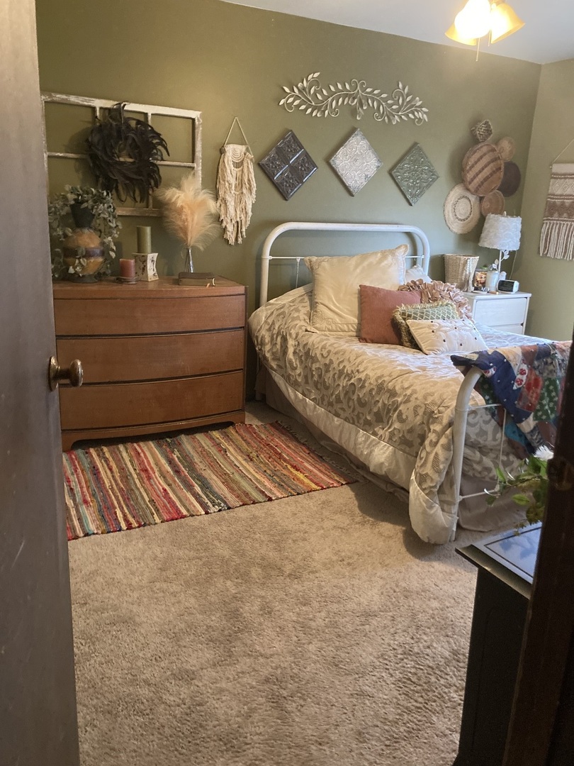 1463 Elder Drive Aurora, IL 60506 - Photo 16 of 32 a bedroom with bed and balcony