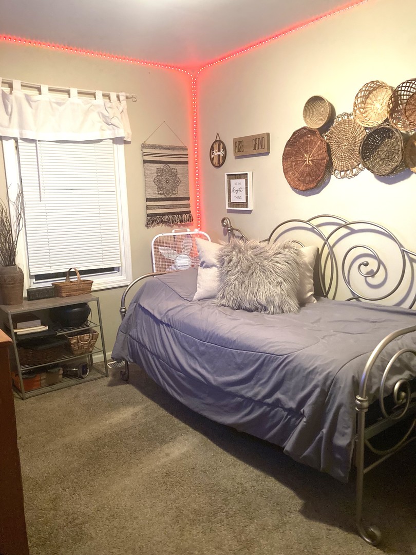 1463 Elder Drive Aurora, IL 60506 - Photo 19 of 32 a bedroom with a bed and a window