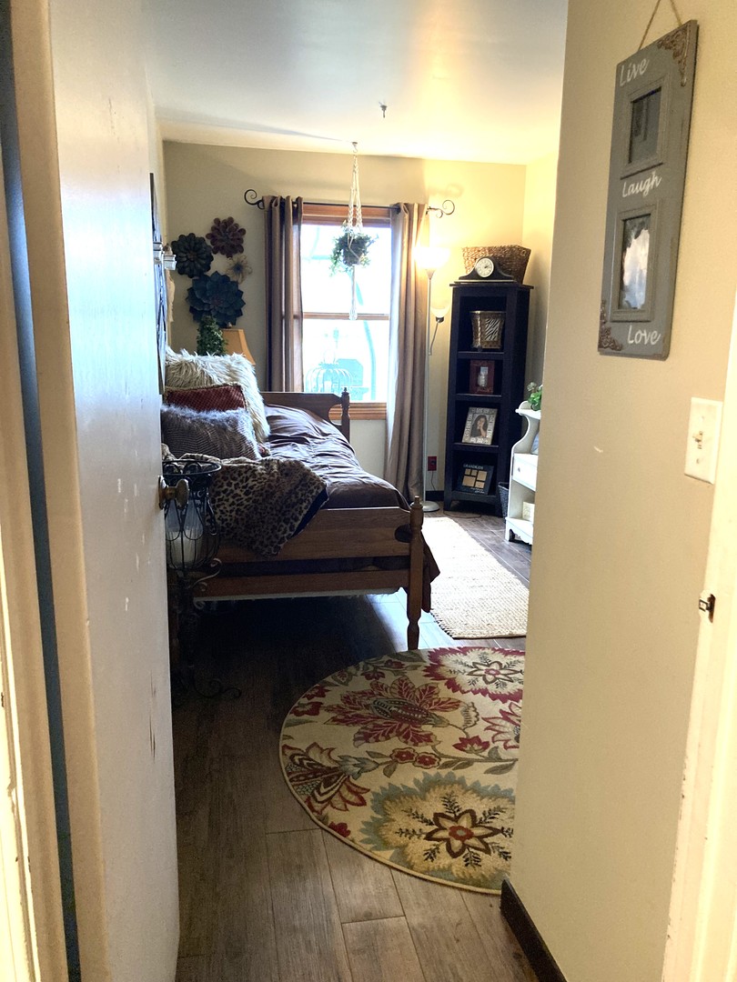 1463 Elder Drive Aurora, IL 60506 - Photo 31 of 32 a bedroom with a bed and a window