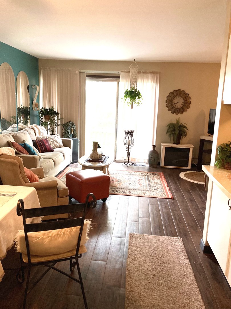 1463 Elder Drive Aurora, IL 60506 - Photo 9 of 32 a living room with furniture wooden floor and a large window