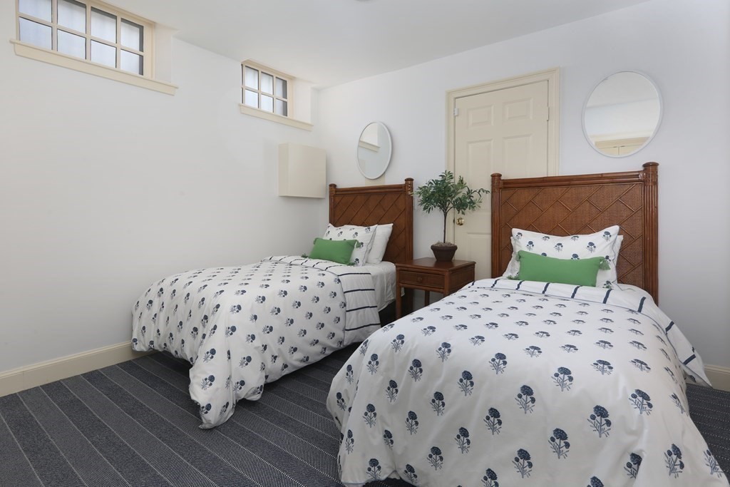 44 Cedar Ln Way Boston, MA 02114 - Photo 11 of 17 a bedroom with two beds and wooden floor