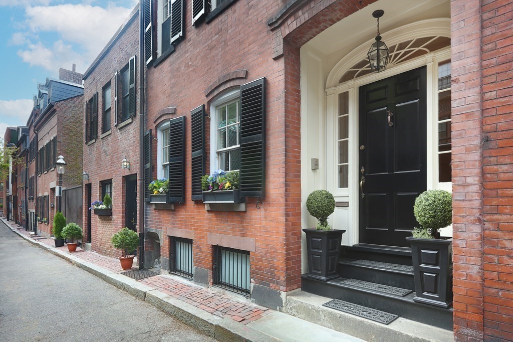 44 Cedar Ln Way Boston, MA 02114 - Photo 17 of 17 a building with potted plants in front of it