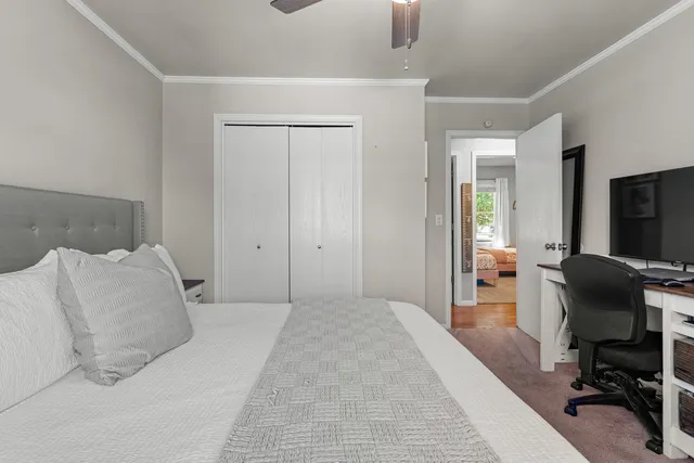 a bedroom with a bed and a chair