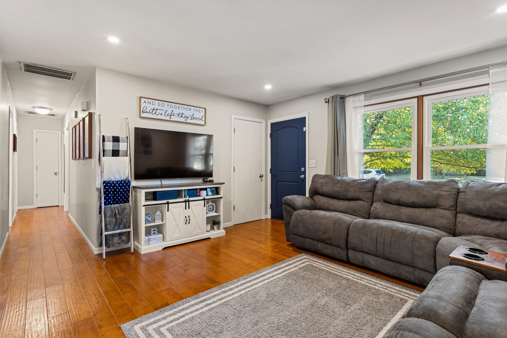 2116 Robin Road Mahomet, IL 61853 - Photo 6 of 27 a living room with furniture and a flat screen tv