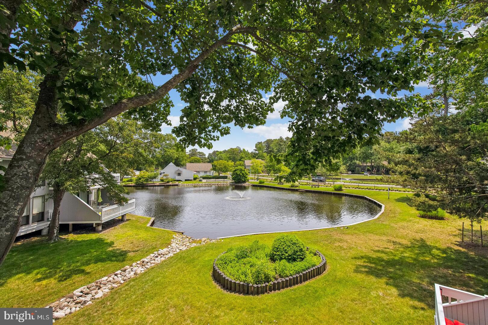 39689 Round Robin Way, Unit 3103 Bethany Beach, DE 19930 - Photo 12 of 34 a view of a swimming pool with an outdoor space and seating area