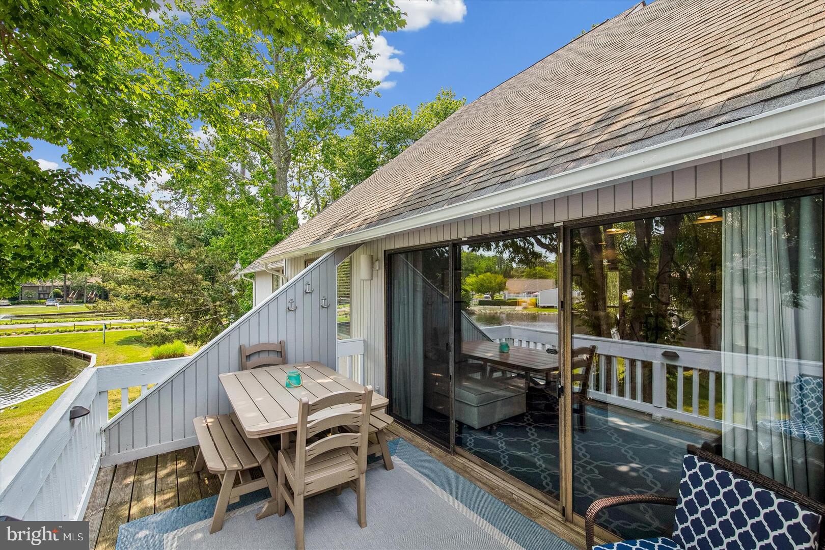 39689 Round Robin Way, Unit 3103 Bethany Beach, DE 19930 - Photo 13 of 34 a balcony view with a seating space