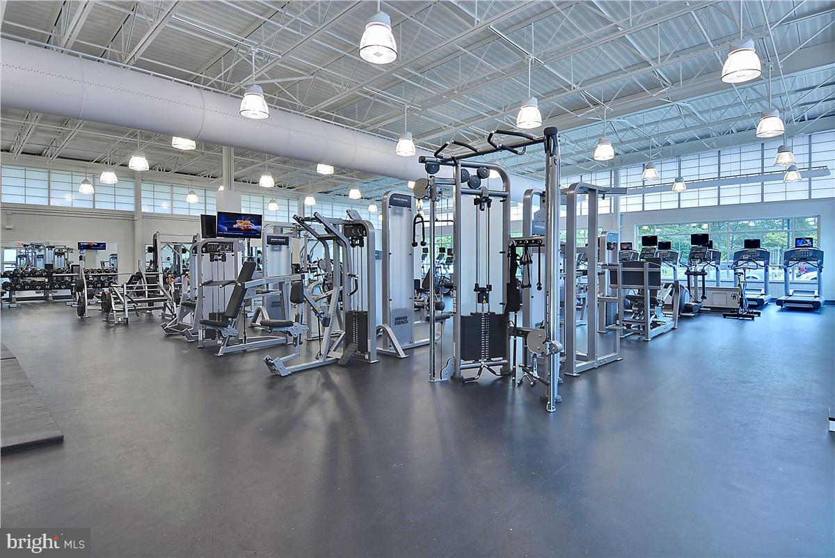 39689 Round Robin Way, Unit 3103 Bethany Beach, DE 19930 - Photo 26 of 34 a view of a room with gym equipment