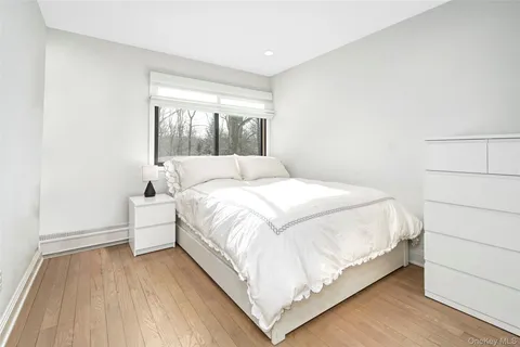 a large white bed in a white room