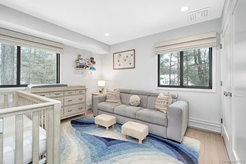 a living room with furniture and windows