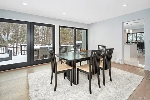 a view of a dining room with furniture window and wooden floor