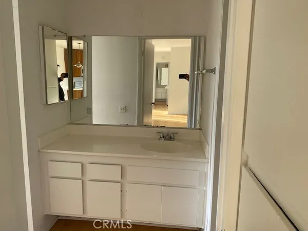 a bathroom with a sink and mirror