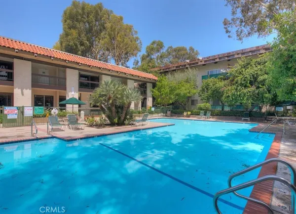 a view of a house with backyard porch and sitting area