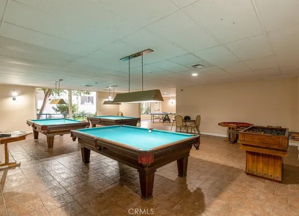 a room with furniture and pool table