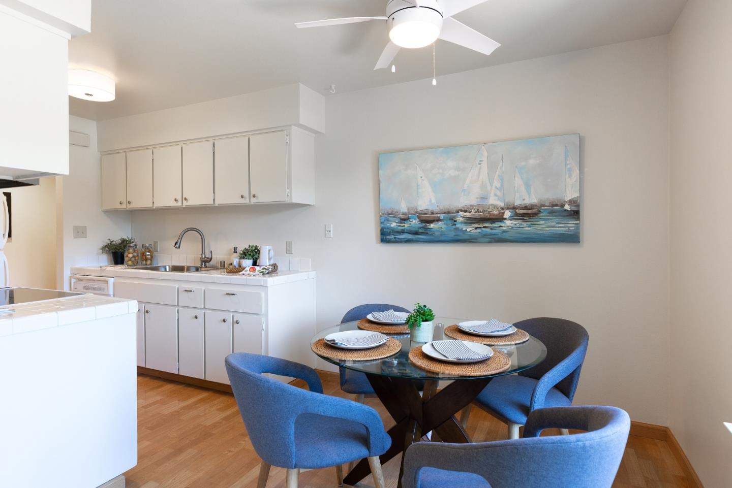 1925 46th Avenue, Unit 105 Capitola, CA 95010 - Photo 8 of 27 a view of a dining room with furniture and window