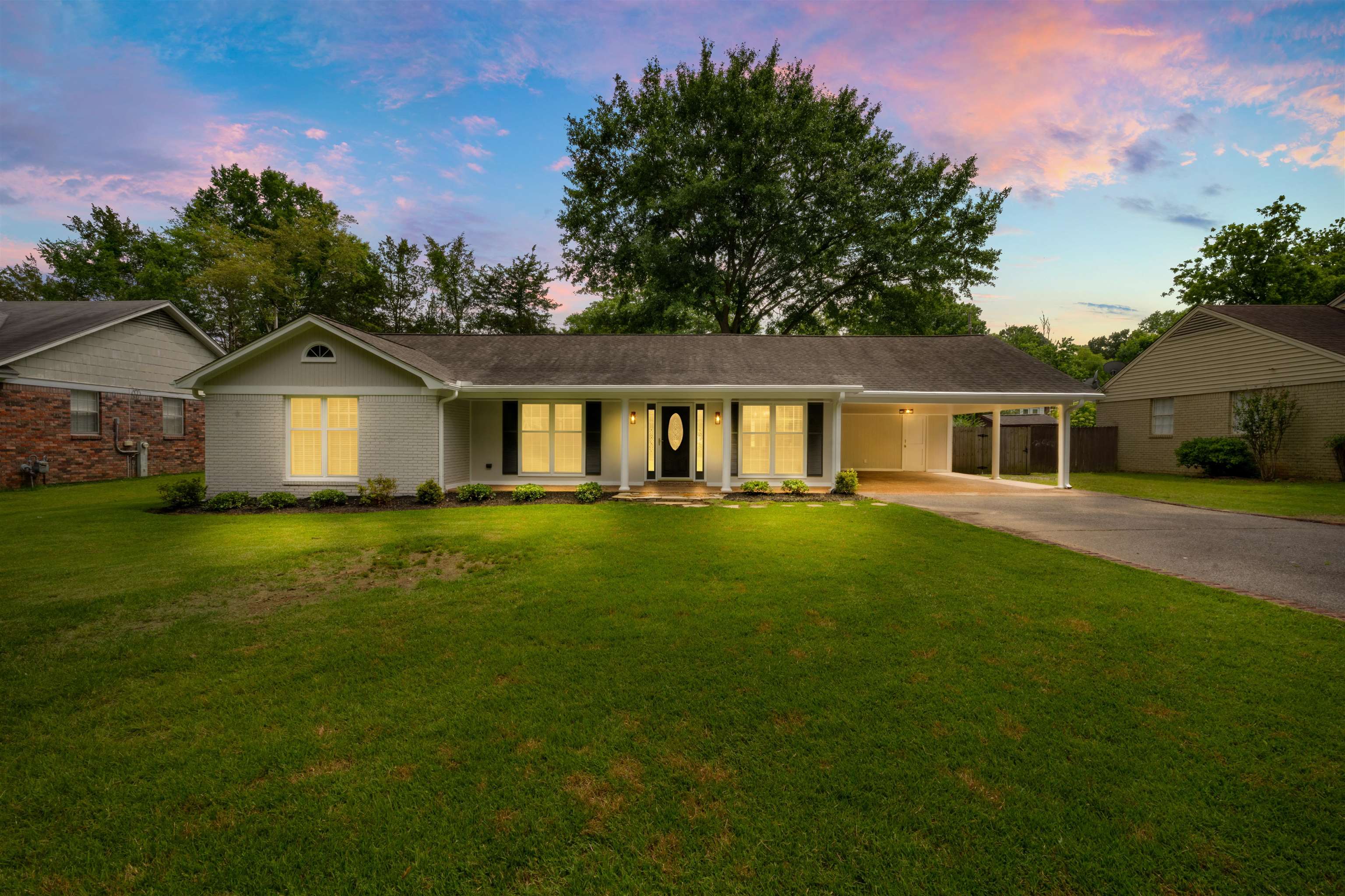 499 Duscoe Street Collierville, TN 38017 - Photo 1 of 38 a front view of a house with a garden