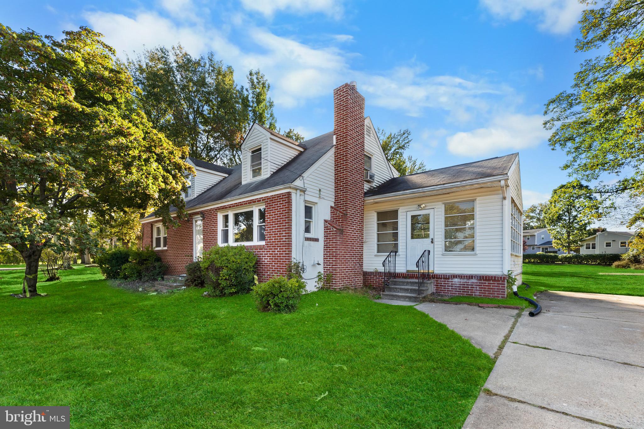 245 Paxson Avenue Hamilton, NJ 08690 - Photo 18 of 26 a front view of a house with garden