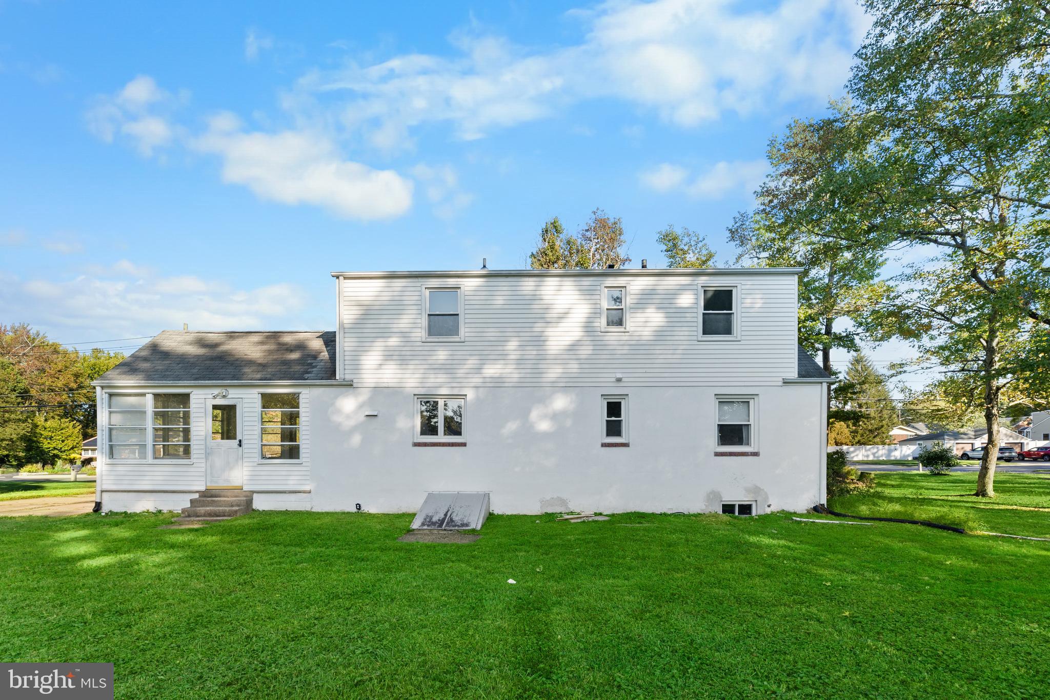 245 Paxson Avenue Hamilton, NJ 08690 - Photo 21 of 26 a view of a back yard of the house with a yard