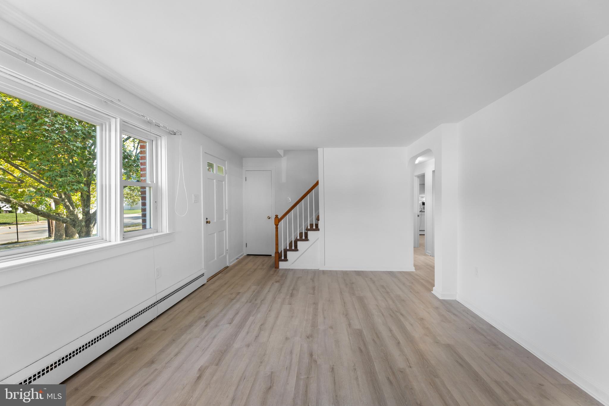 245 Paxson Avenue Hamilton, NJ 08690 - Photo 6 of 26 a view of empty room with wooden floor and fan