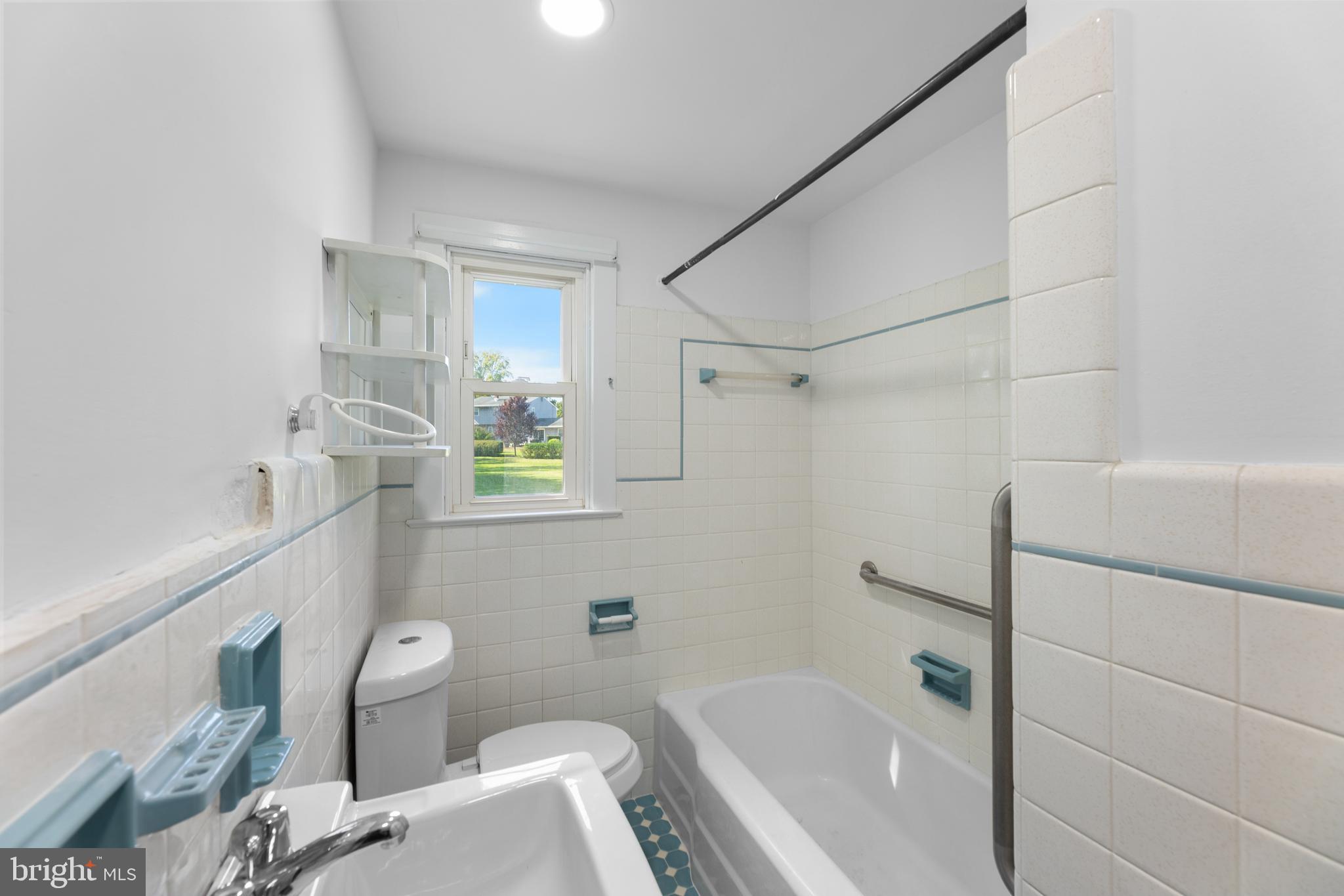 245 Paxson Avenue Hamilton, NJ 08690 - Photo 9 of 26 a bathroom with a sink a toilet and shower