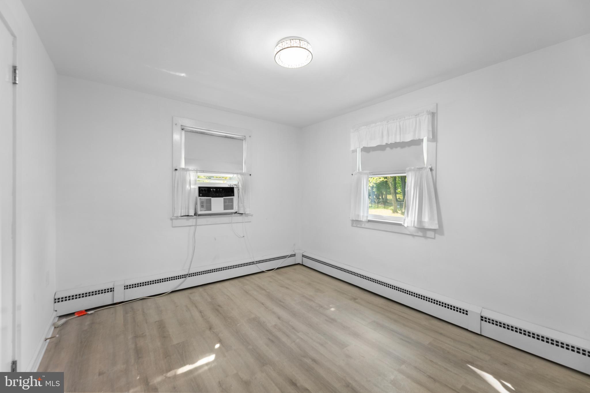 245 Paxson Avenue Hamilton, NJ 08690 - Photo 10 of 26 an empty room with a window