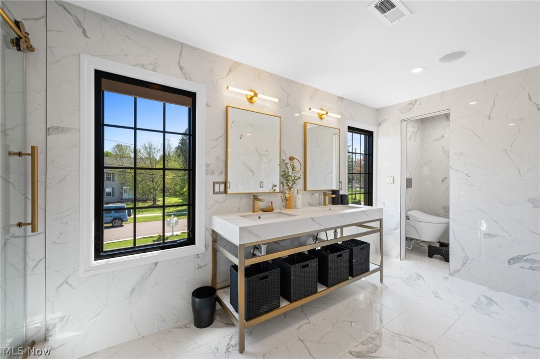 25870 Kennedy Ridge Road North Olmsted, OH 44070 - Photo 34 of 50 Spacious bathroom featuring marble-look wall and floor tiling
