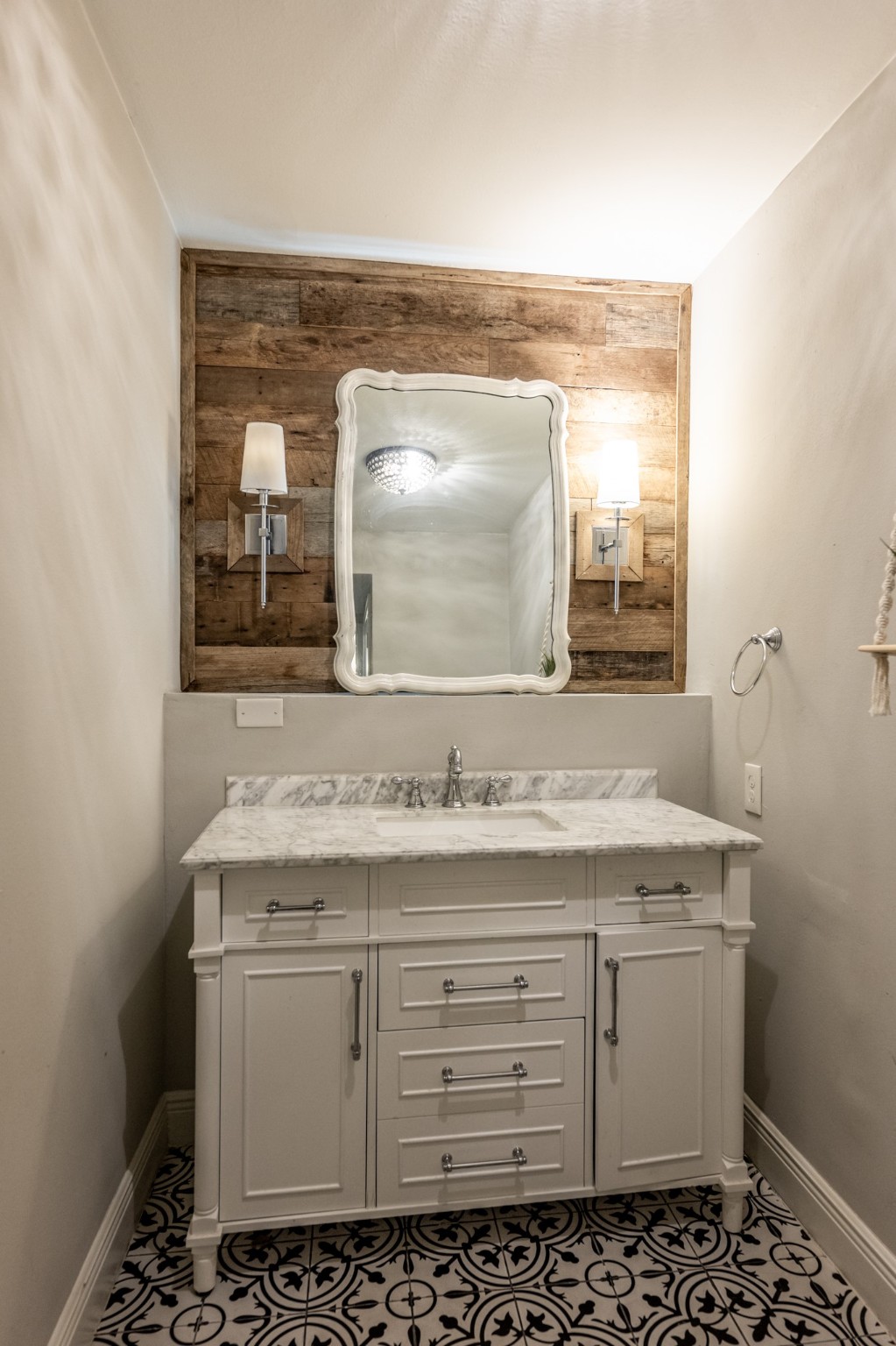 2120 Ave R Huntsville, TX 77340 - Photo 11 of 31 a bathroom with a granite countertop sink and a mirror