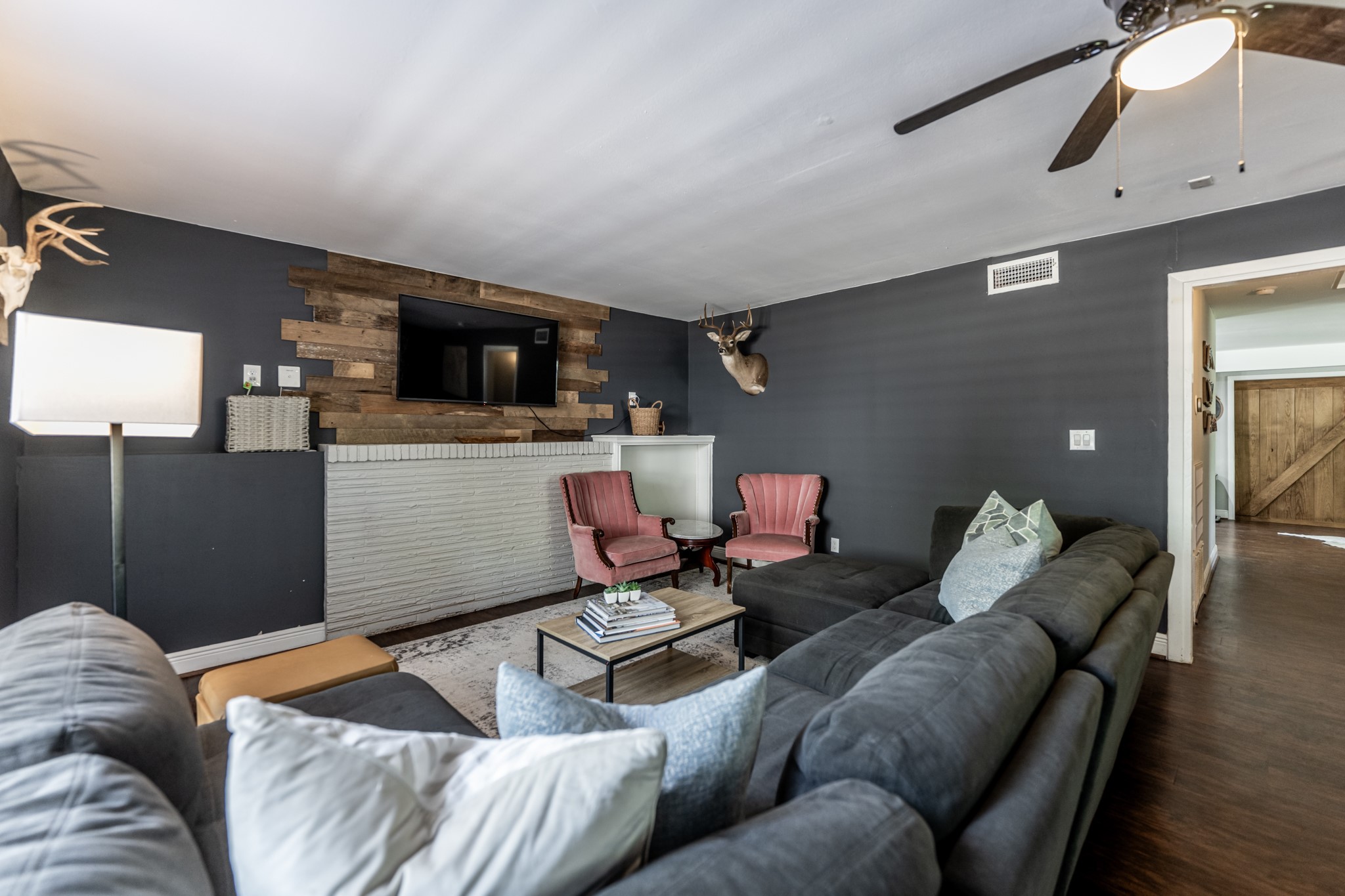 2120 Ave R Huntsville, TX 77340 - Photo 13 of 31 a living room with furniture and a flat screen tv