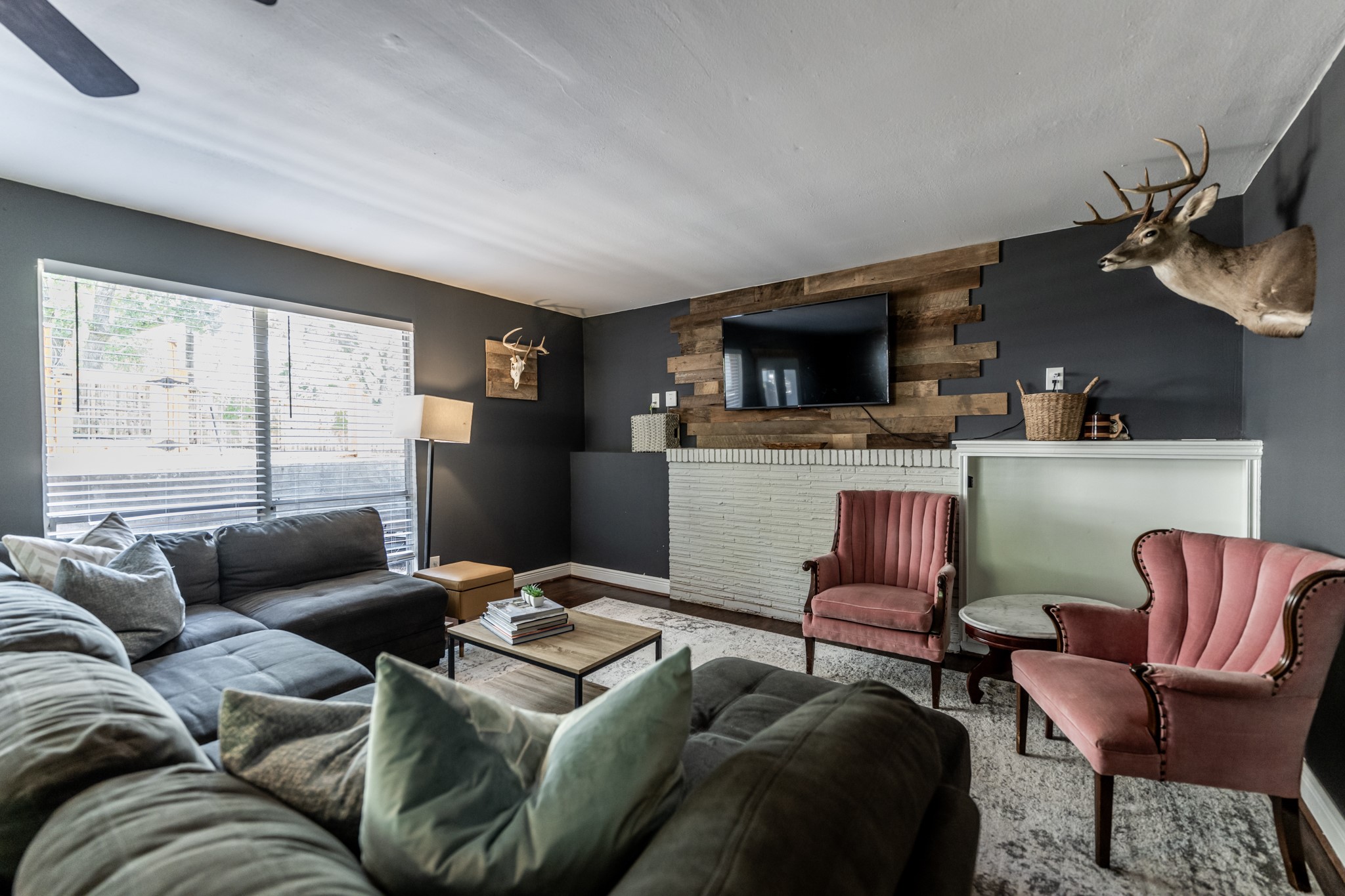 2120 Ave R Huntsville, TX 77340 - Photo 14 of 31 a living room with furniture and a flat screen tv