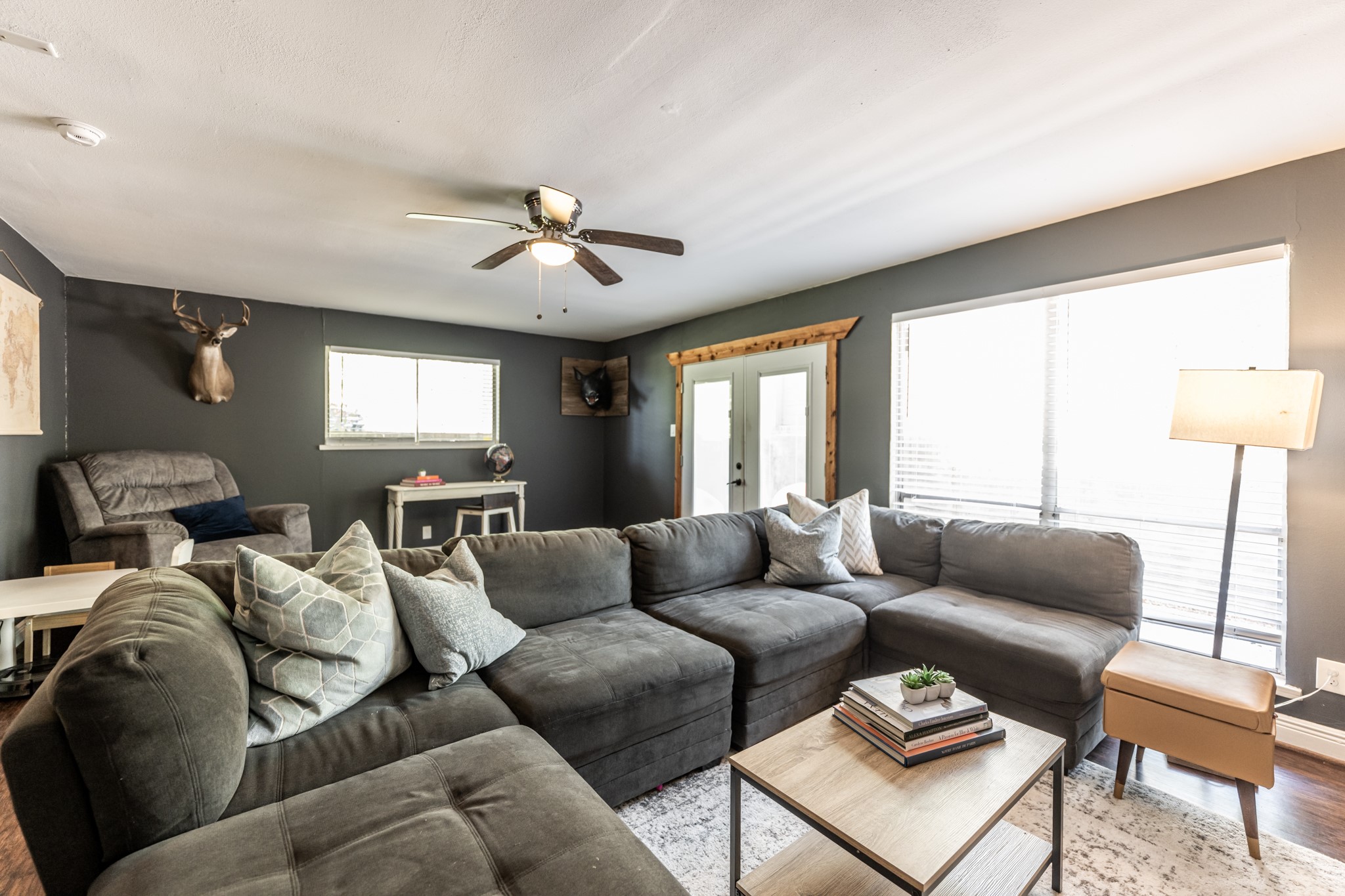 2120 Ave R Huntsville, TX 77340 - Photo 16 of 31 a living room with furniture ceiling fan and a window