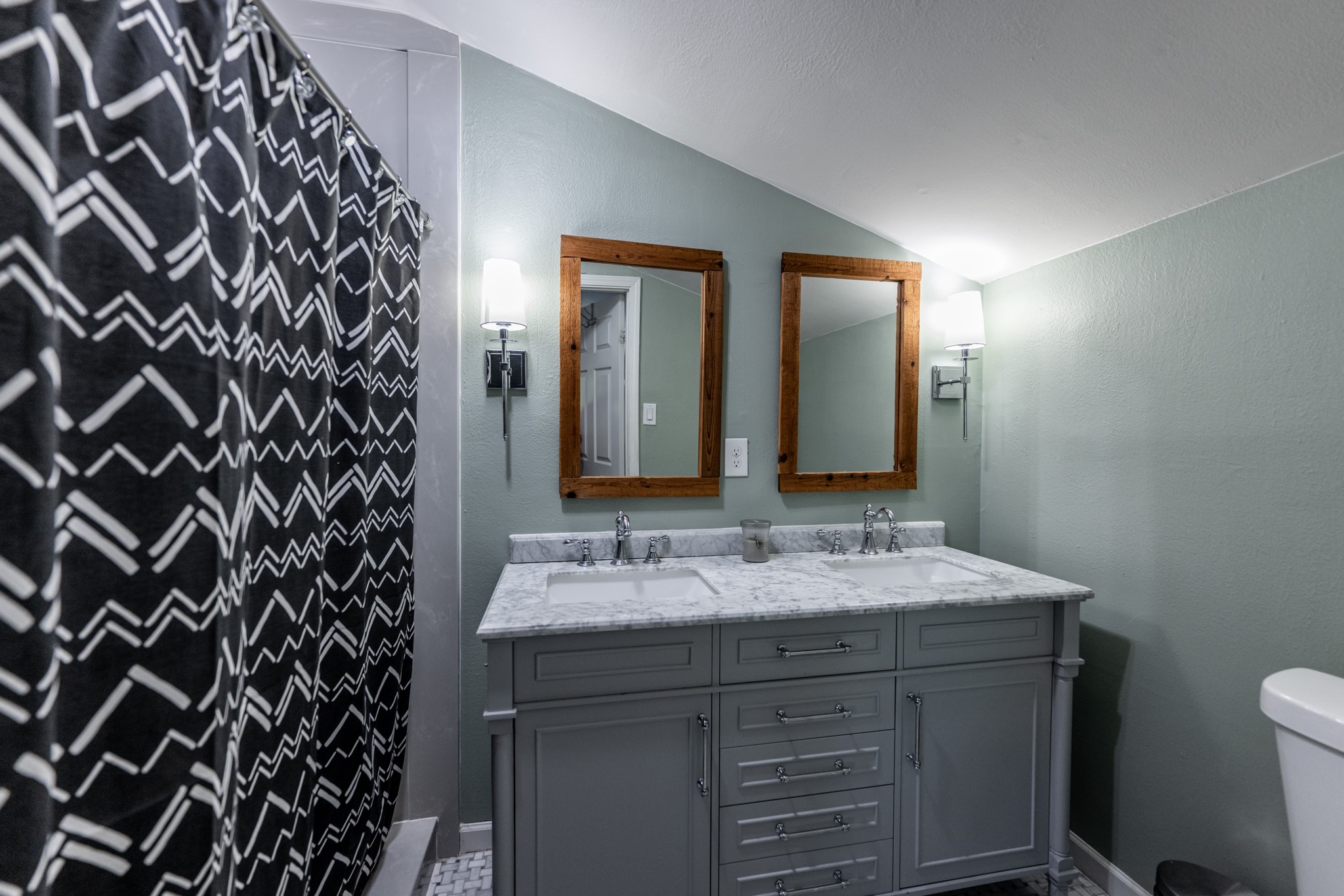 2120 Ave R Huntsville, TX 77340 - Photo 20 of 31 a bathroom with a sink and a mirror