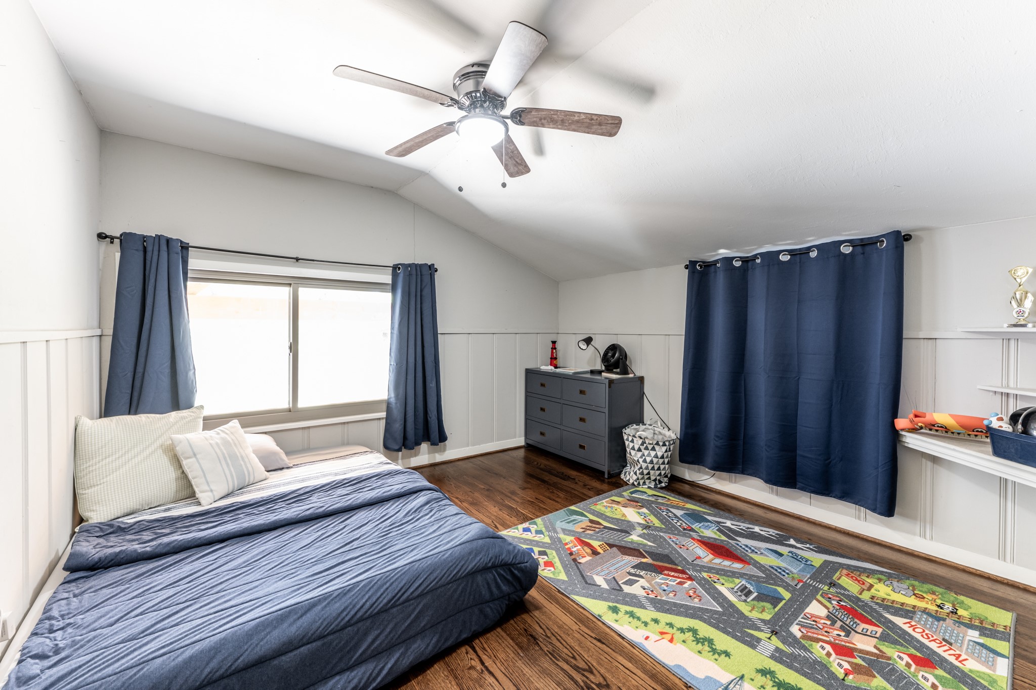 2120 Ave R Huntsville, TX 77340 - Photo 25 of 31 a bedroom with bed and wooden floor