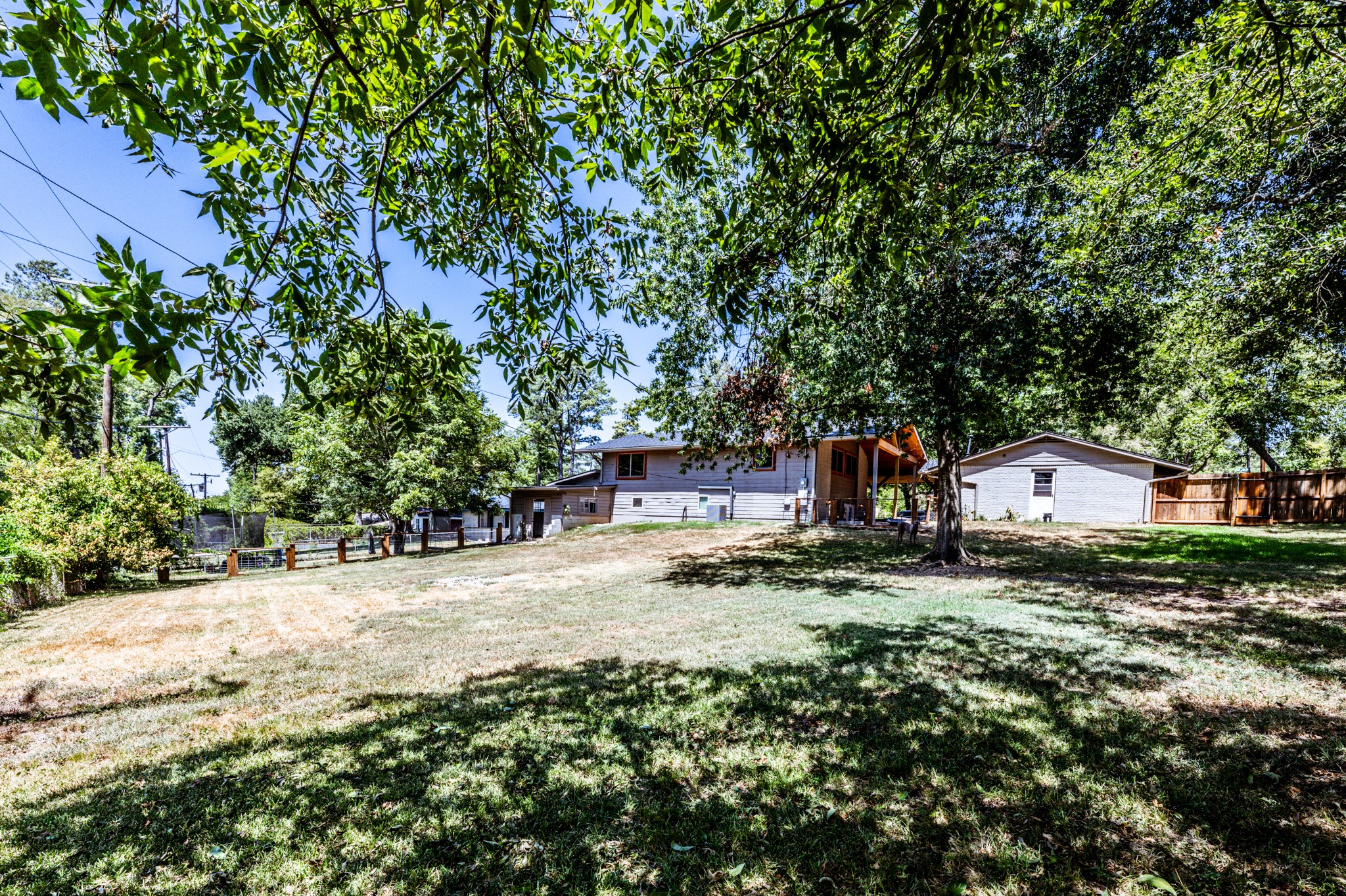 2120 Ave R Huntsville, TX 77340 - Photo 29 of 31 a view of a house with a yard