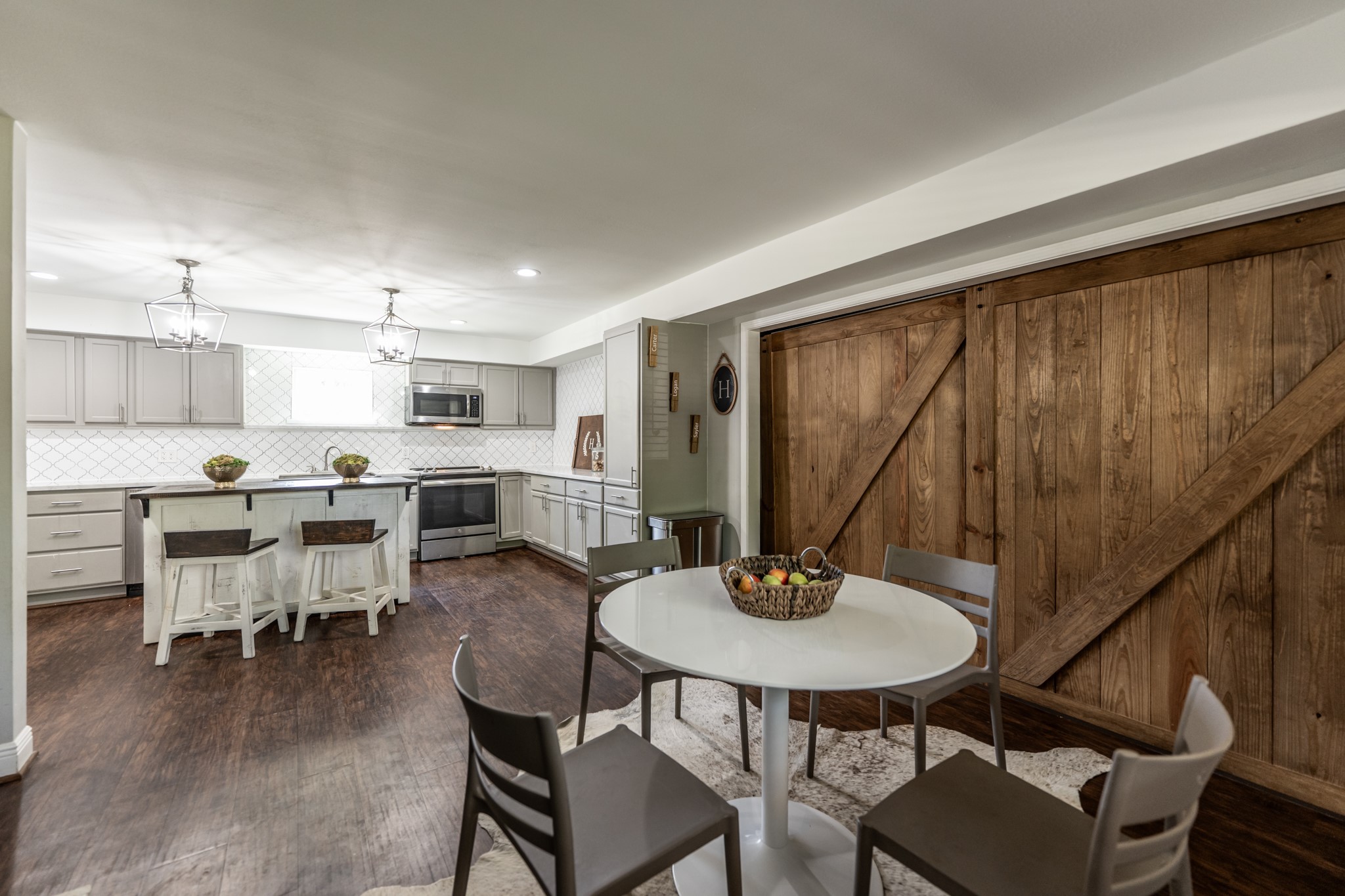 2120 Ave R Huntsville, TX 77340 - Photo 5 of 31 a view of a dining room with furniture and wooden floor