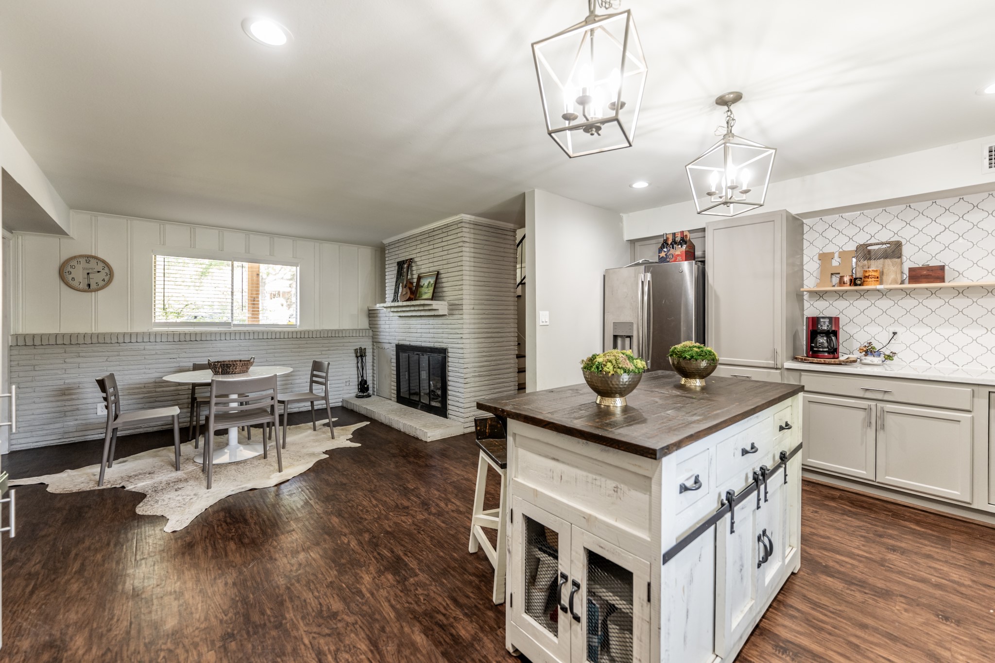 2120 Ave R Huntsville, TX 77340 - Photo 7 of 31 a kitchen with stainless steel appliances granite countertop a stove and a wooden floors