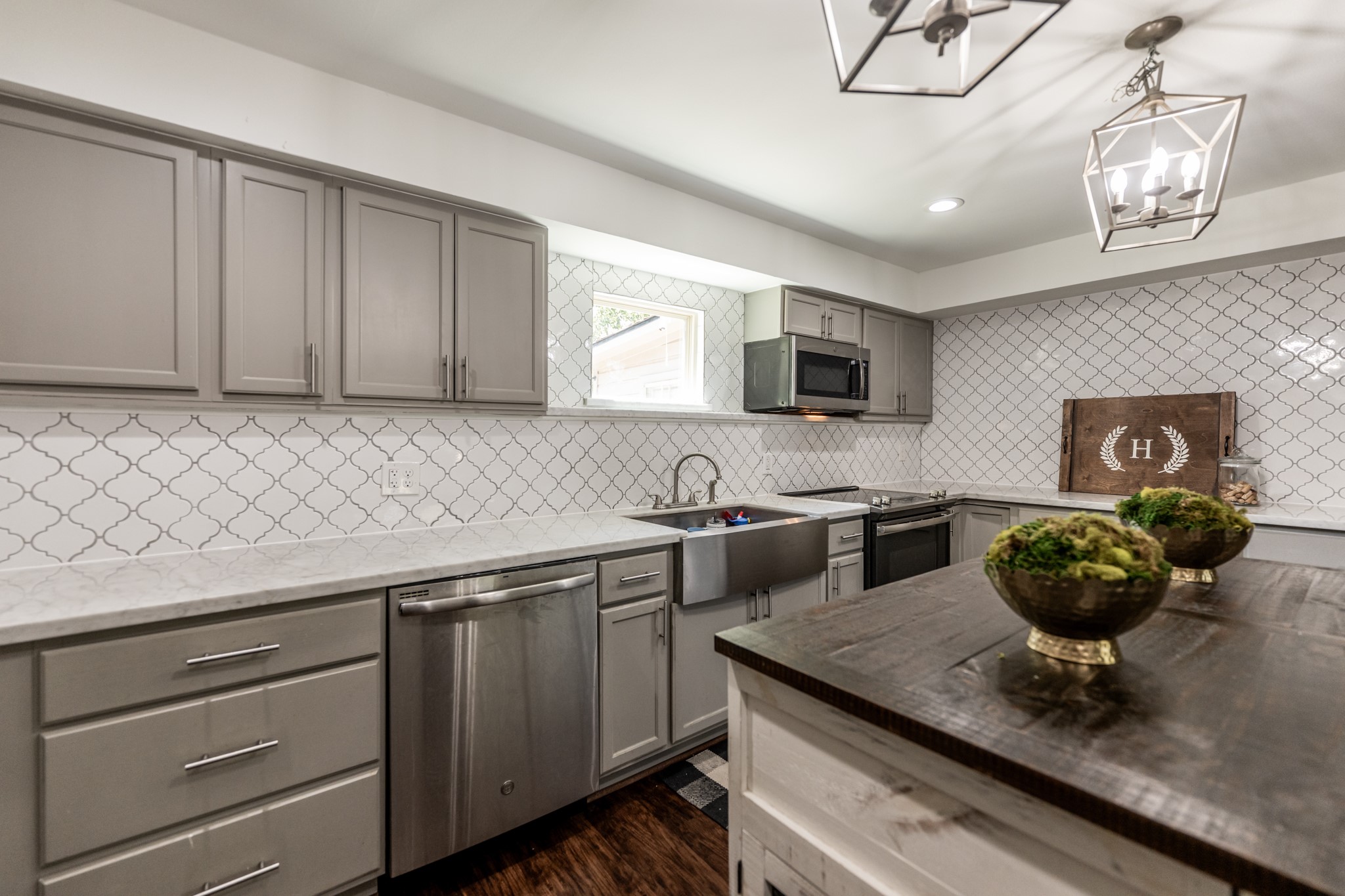2120 Ave R Huntsville, TX 77340 - Photo 8 of 31 a kitchen with a sink stainless steel appliances and cabinets