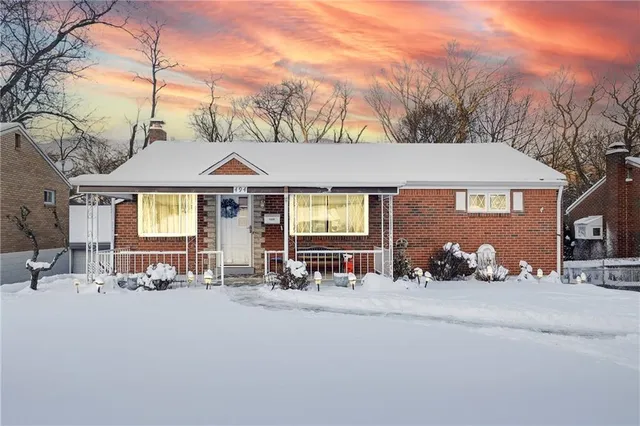 a front view of a house with sitting area