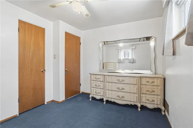 a view of room with hardwood floor and closet