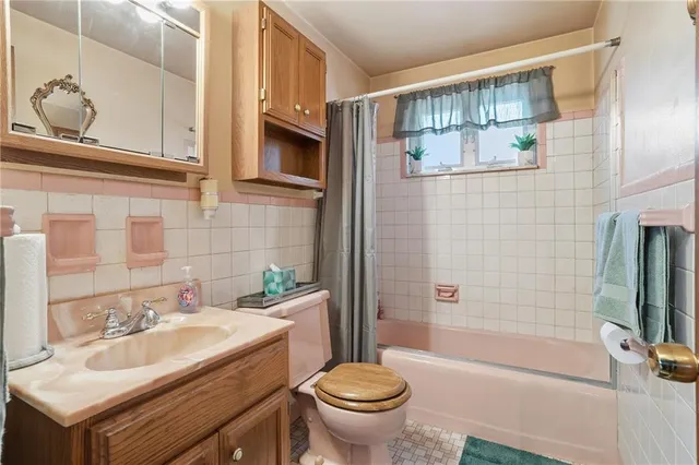 a kitchen with stainless steel appliances granite countertop a stove a sink dishwasher and a refrigerator with wooden floor