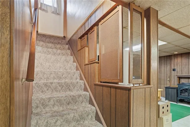a view of a room with furniture and a kitchen