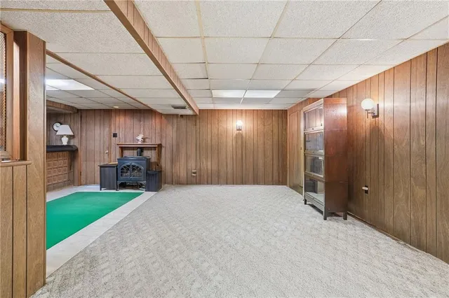 a bed room with a bed and a book shelf