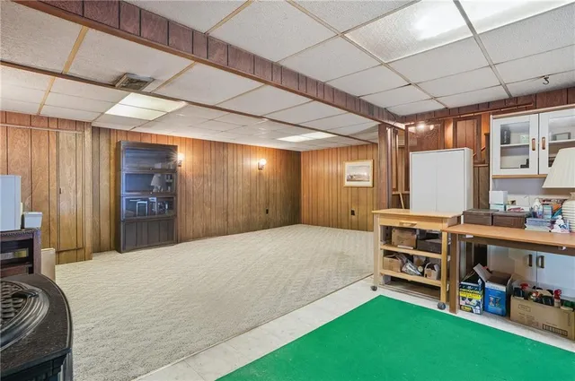 a spacious bedroom with a bed and a window