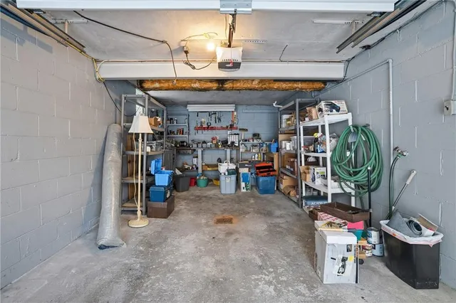 a view of a house with a yard and garage