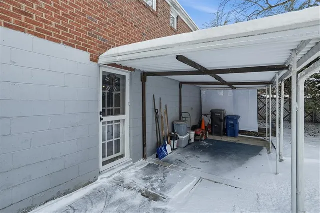 a view of a house with a snow in a yard