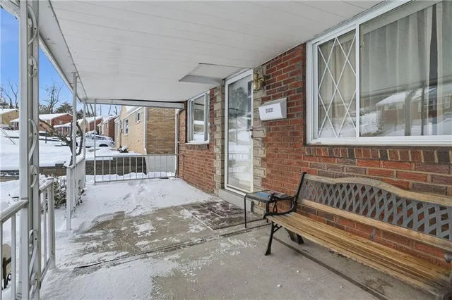 a room that has a couch and a window