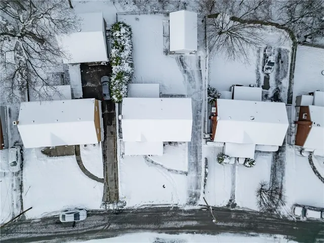 an aerial view of a houses with yard