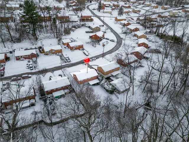 a front view of a house with sitting area
