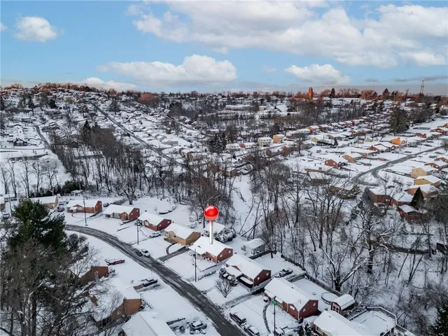 a front view of a house with a yard and a garage