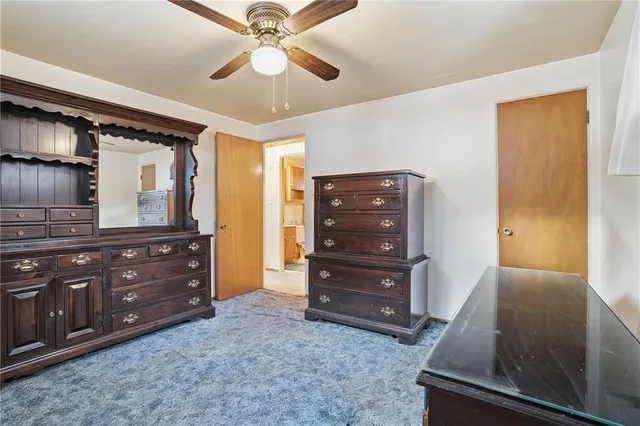 a bathroom with a granite countertop double vanity sink mirror and